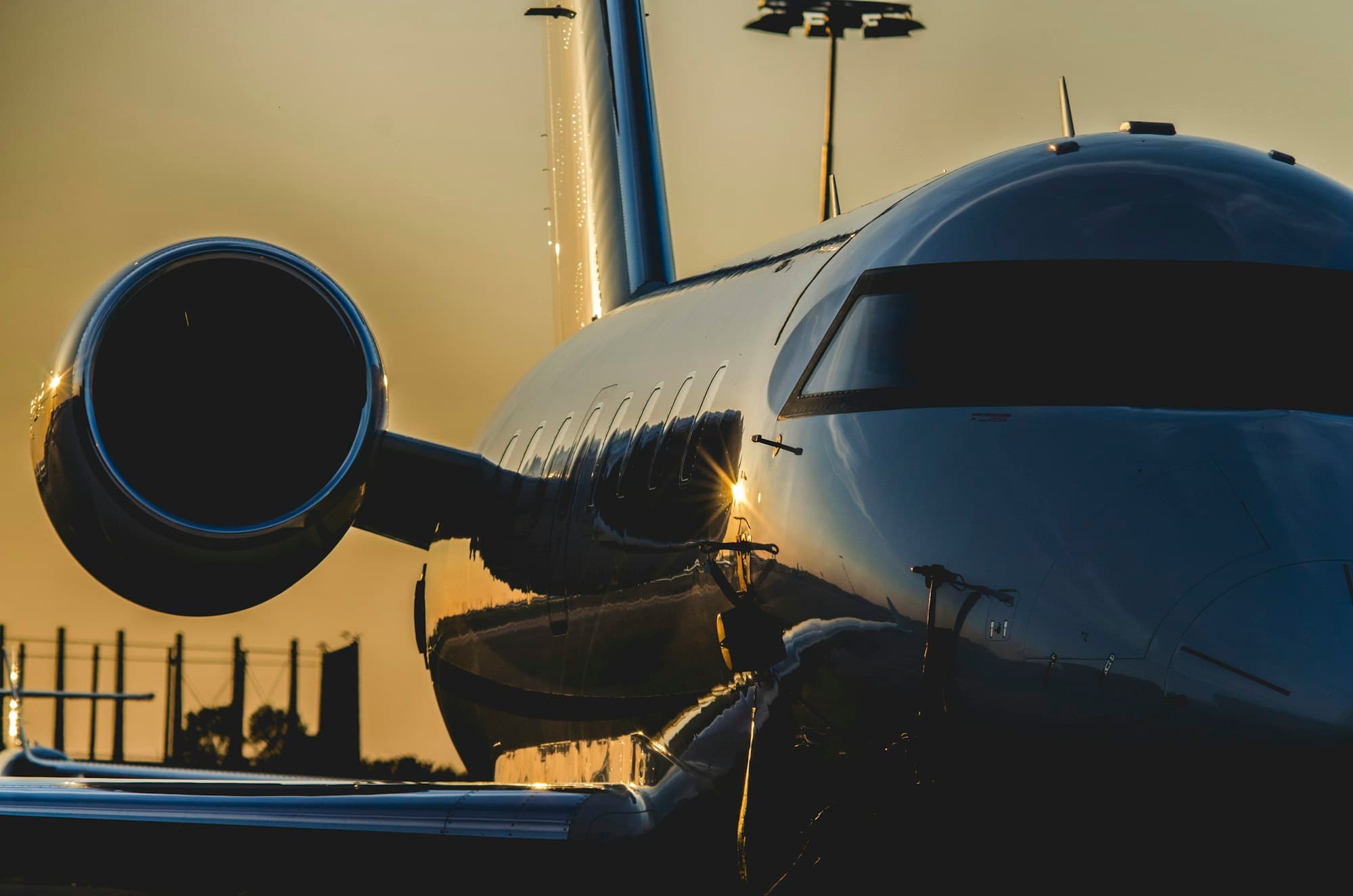 Private jet nose and engine in golden evening light