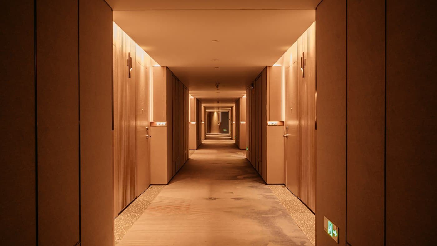 Warm-lit hotel corridor